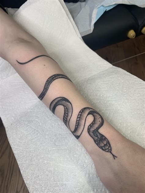 The Artistry Of A Snake Wrapped Around Rose Tattoo Tips