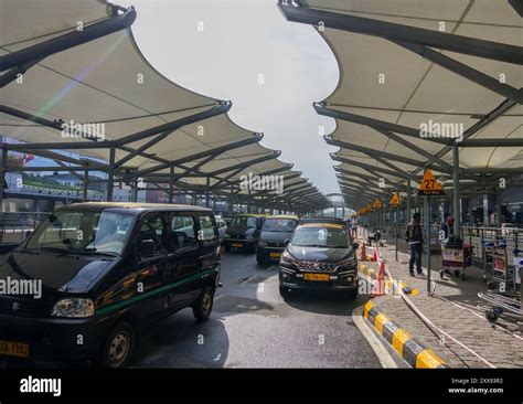 New Delhi, India - March 03, 2024: Taxi cars in the airport parking lot ...