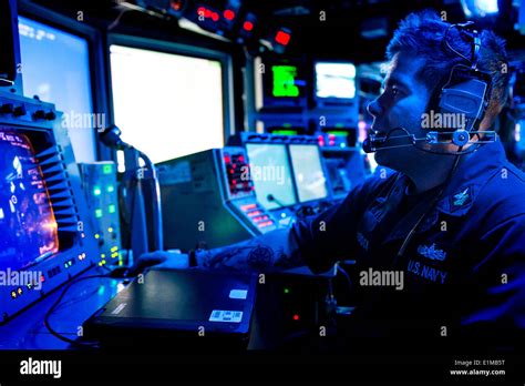 U S Navy Fire Controlman St Class Aaron Tadlock Monitors A Radar