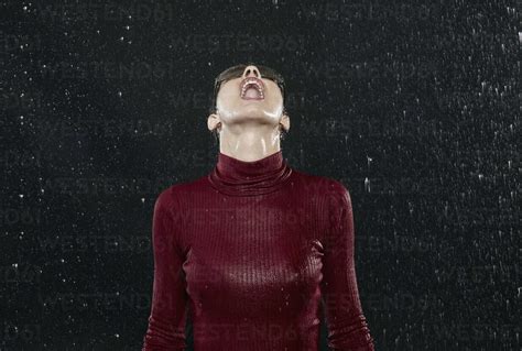 Woman Getting Wet In Rain Stock Photo