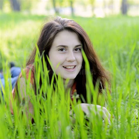 Smiling girl in the grass stock image. Image of meadow - 43929103