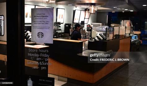 A Starbucks Employee Cleans Up After Closing In Los Angeles News