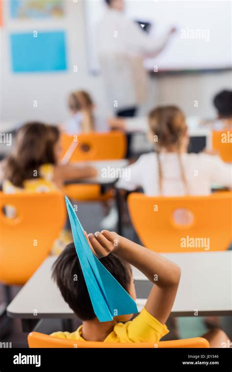 Students Throwing Paper Plane Stock Photo Alamy