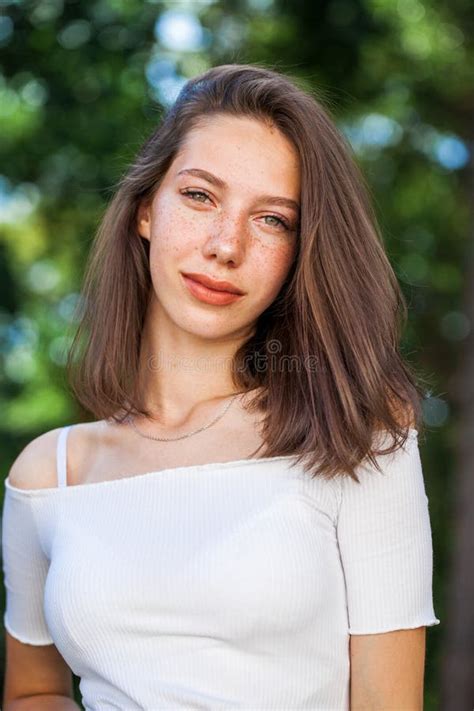 Young Beautiful Brown-haired Girl with Freckles on Her Face Stock Image ...