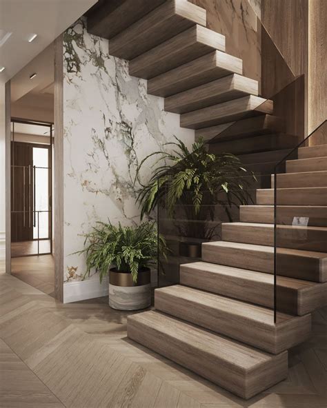 There Is A Potted Plant Next To The Stairs In This Modern Style House