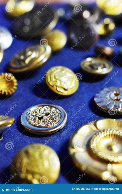 Gold Sewing Buttons on a Blue Background Stock Photo - Image of blue ...