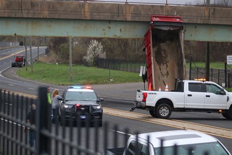 Dump Truck Strikes Overpass Causes Road Closure