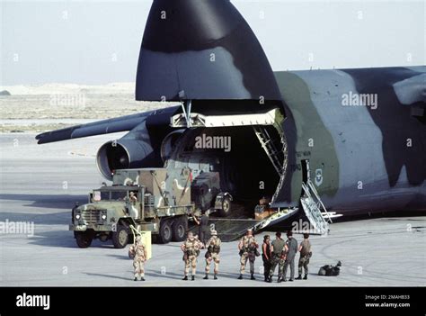 An M 923 5 Ton Cargo Truck Carrying A Shelter And Towing A Trailer Is