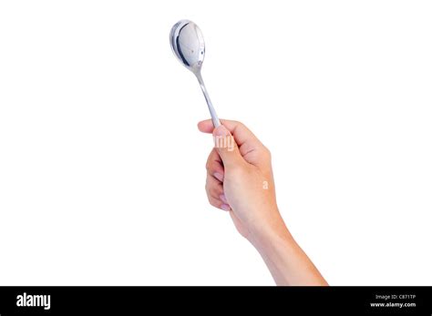 Man Hand Holding A Spoon Isolated With Clipping Path In  Stock