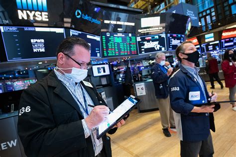 Stock futures fall after Wall Street closed at record highs to end last