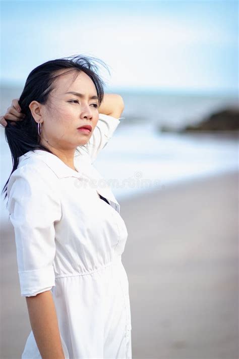 Asian Woman Standing Alone On The Beach Stock Photo Image Of