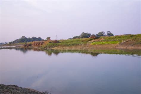 Arial View Canal With Green Grass And Vegetation Reflected In The Water Nearby Padma River Stock