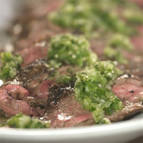 The Meat And Broccoli Is Being Cooked On The Grill