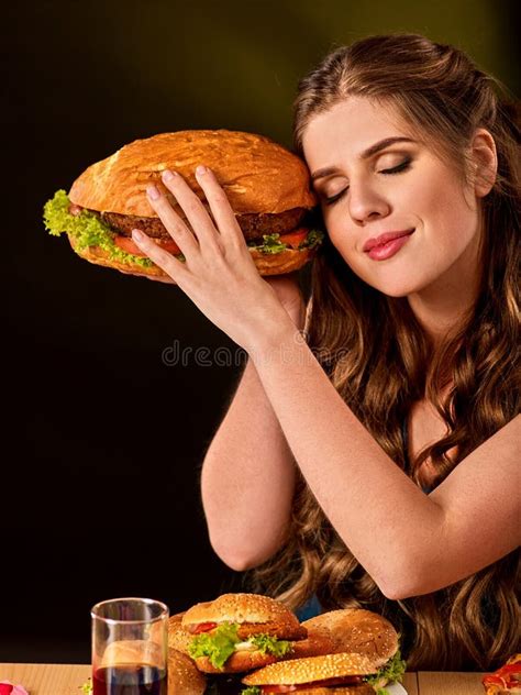 Woman Eating French Fries And Hamburger With Pizza Stock Image Image