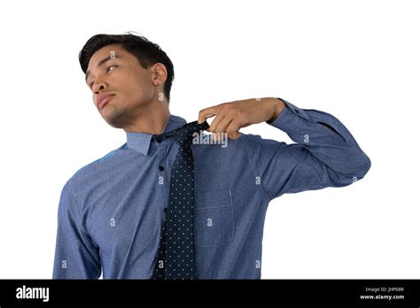 Businessman Loosening Necktie Hi Res Stock Photography And Images Alamy