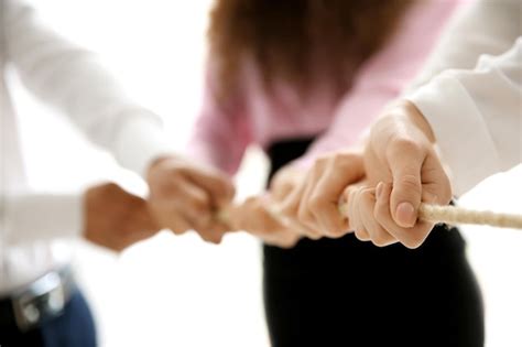 Premium Photo People Hands Pulling Rope For Playing Tug Of War Closeup