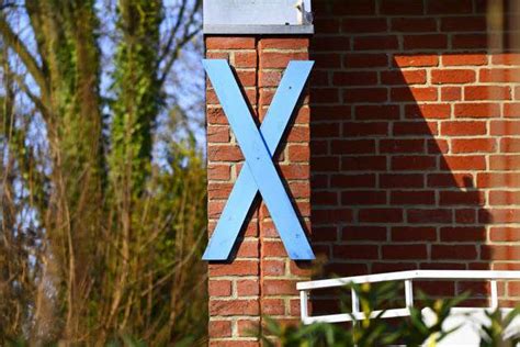 Blue Wooden Cross As A Protest Sign Against The Construction Of The