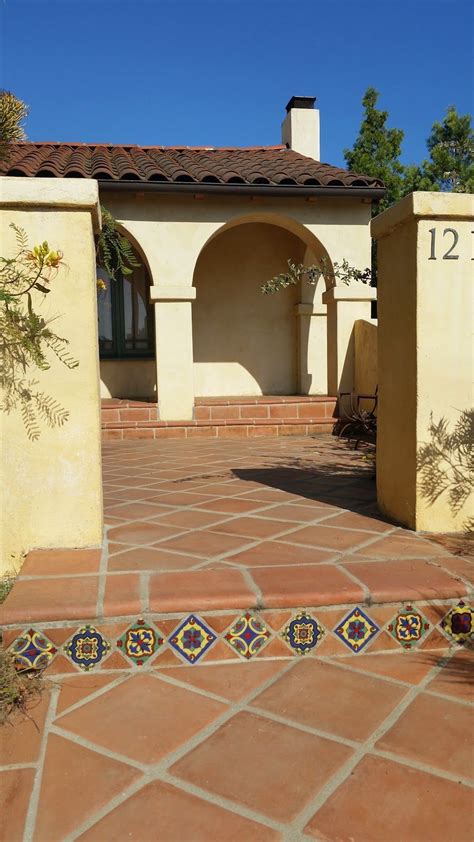 Both Spanish Pavers And Decorative Riser Tiles Are On Point In This