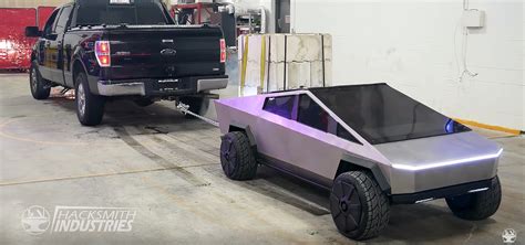 Tesla Cybertruck Mini Takes Out Full Sized Ford F In Tug Of War Bout