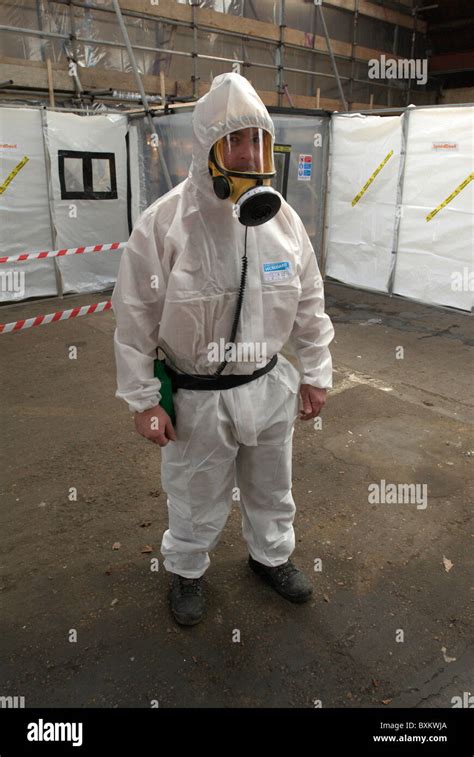 Asbestos Removal Man In Full Protective Clothing United Kingdom Stock