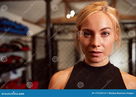 Portrait Of Female Mixed Martial Arts Fighter Training In Gym Stock