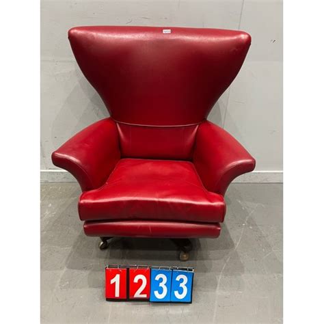 Mid Century Red Leather Wing Back Swivels Chair