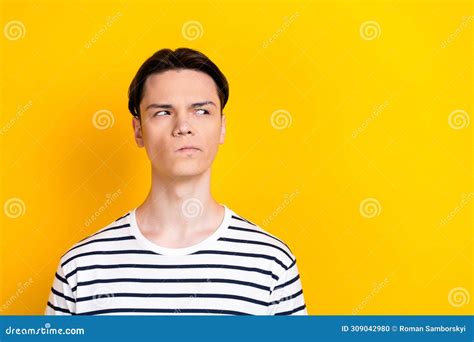 Photo Of Minded Guy With Brunet Hairdo Dressed Striped T Shirt Look At Proposition Empty Space