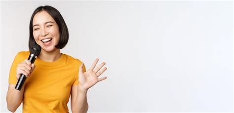 Free Photo Image Of Young Asian Woman Talking In Microphone Perfom