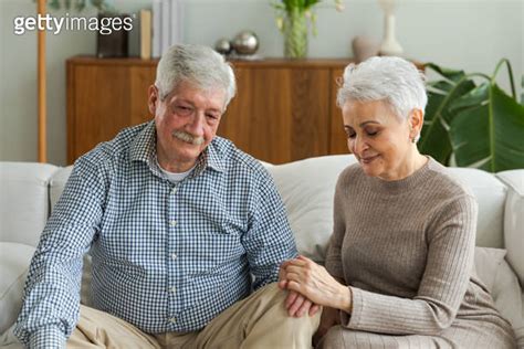 Senior Adult Mature Couple In Love Holding Hands At Home Mid Age Old