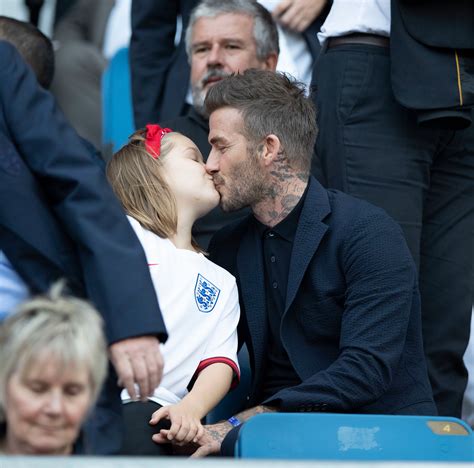 David Beckham kisses daughter Harper on the lips at football match ...