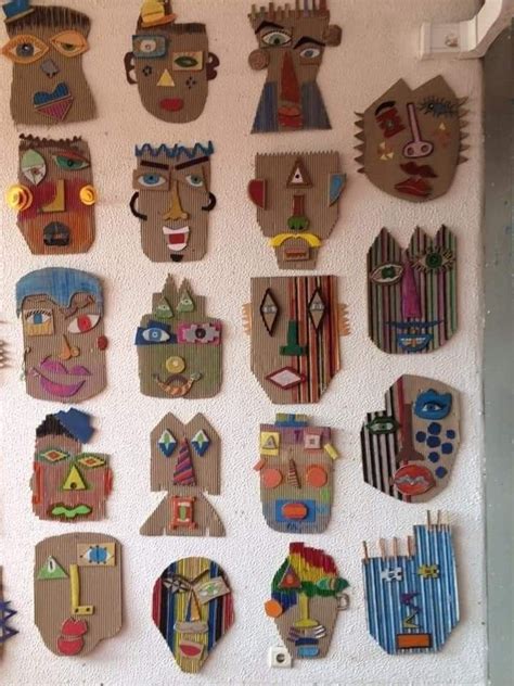 A Group Of Wooden Masks Mounted To The Side Of A Wall