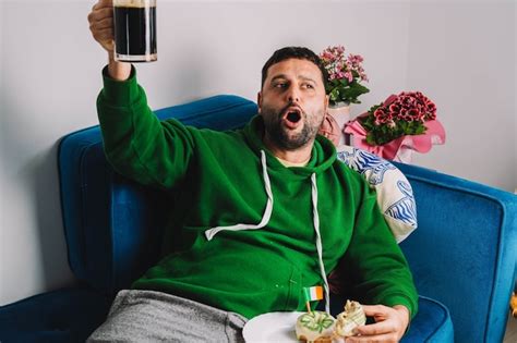 Premium Photo A Single Man Having Donuts And Stout For Breakfast To