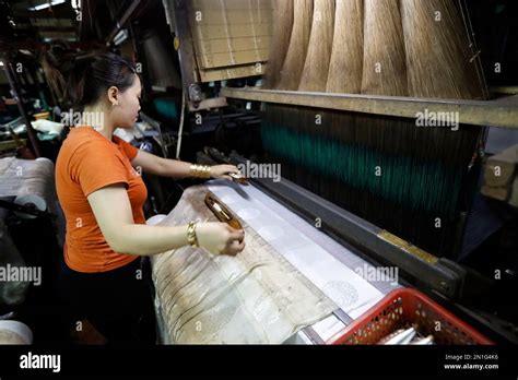 A Traditional Silk Factory Woman Working On An Old Silk Loom Tan Chau