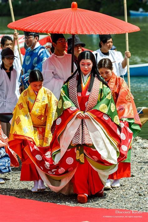 A Woman Dressed As Sei Shonagon Along With Other Men And Women Wearing