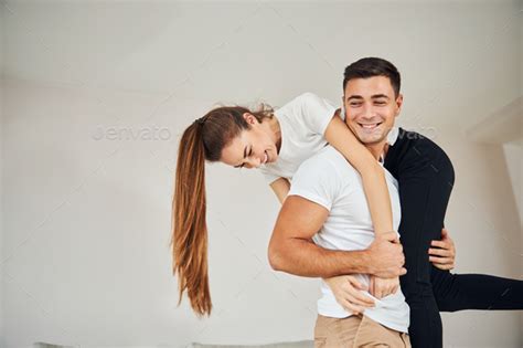 Guy Carrying Girl Over Shoulder