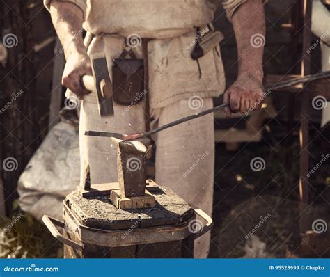 Blacksmith Forges Part On Anvil In Antique Clothes Stock Image Image