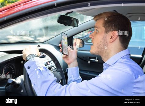 Driver Had Almost Accident While Using Phone While Driving Car Stock Photo - Alamy