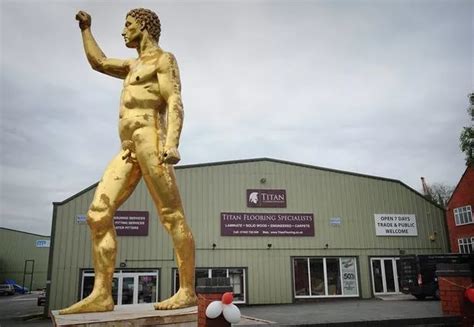 Giant 30ft Gold Naked Statue With Unmissable Features Towed Away