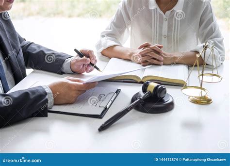 Businesswoman And Male Lawyer Or Judge Consult And Conference Having