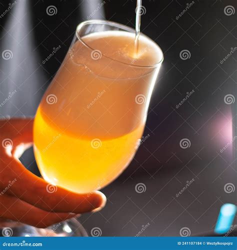 Man Pouring Craft Beer From Beer Taps In Frozen Glass With Froth