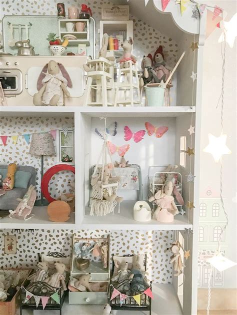 A Doll House With Lots Of Furniture And Accessories On Its Shelves In