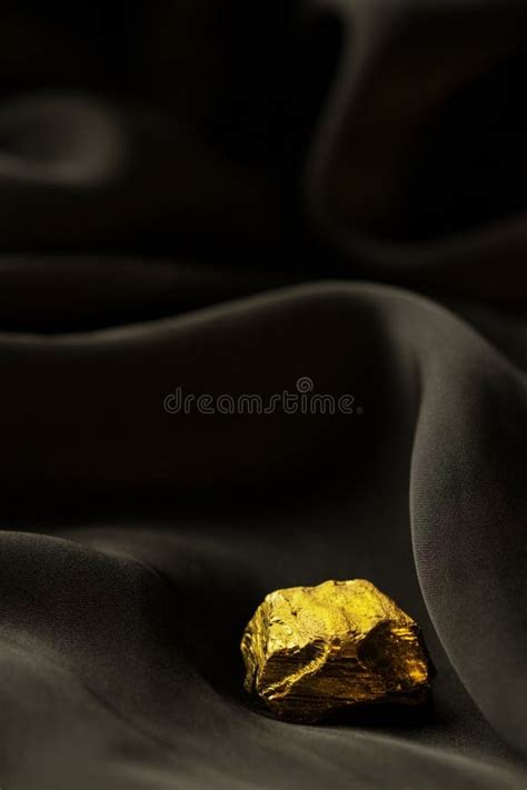 Raw Gold Nugget On Dark Soft Cloth Background Stock Photo Image Of