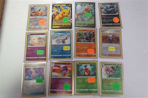 12 POKEMON FOIL CARDS AND 2 POGS - McPherson Auction & Realty