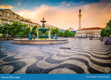 Rossio Square In The Central Lisbon With A Monument Of The King Pedro