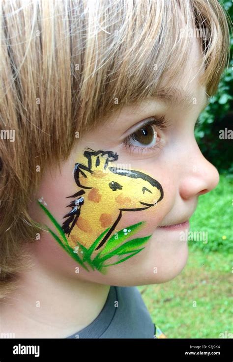 Boy with giraffe face paint Stock Photo - Alamy