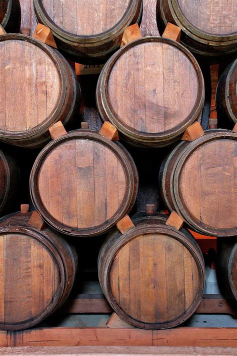 Wine Barrels Stacked Inside Winery Photograph By Yinyang Pixels