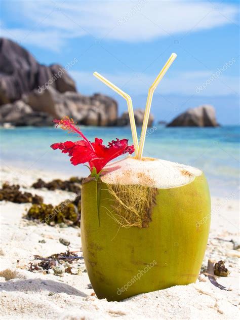 Tropical Coconut Drink at the Beach on La Digue island Stock Photo by ...