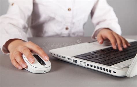 Woman`s Hand With Computer Mouse On Table White Computer Stock Image