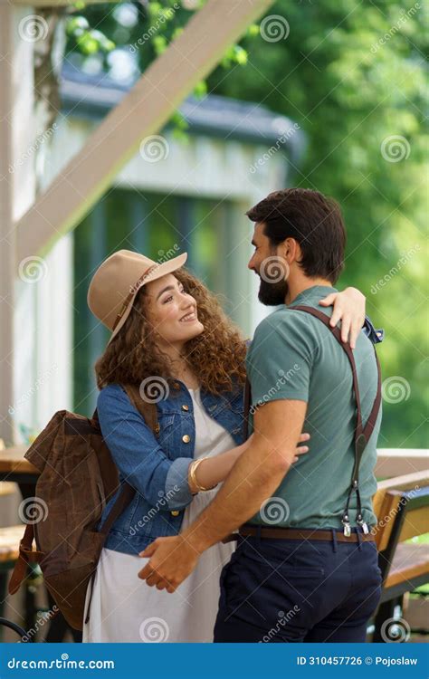 Friends Meeting At A Restaurant Terrace Greeting Hugging After Long