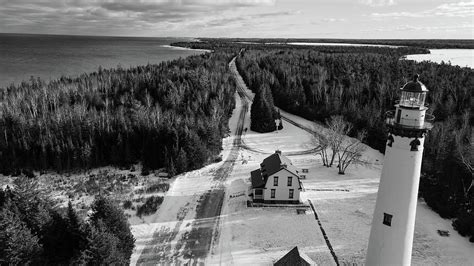 New Presque Isle Lighthouse During Winter Located Along Lake Huron In